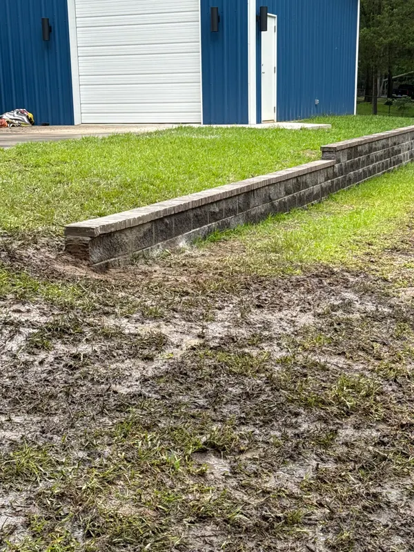 Block retaining wall along a driveway