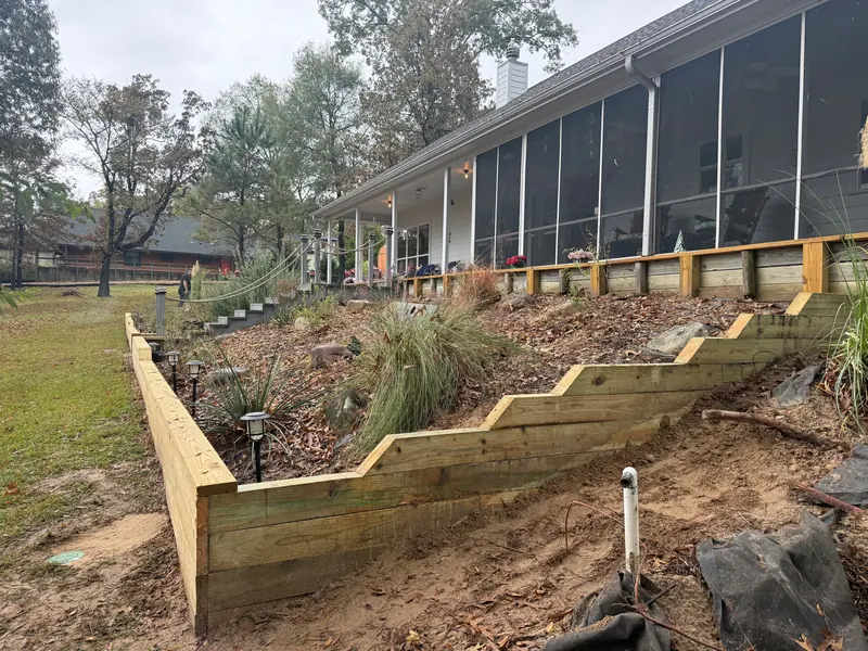 Stepped timber garden beds on a sloped backyard